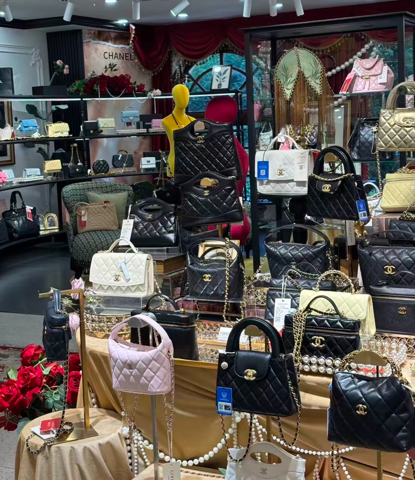 Quilted handbags in various colors and sizes arranged on display stands